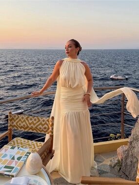 Elegant pale yellow dress with cape